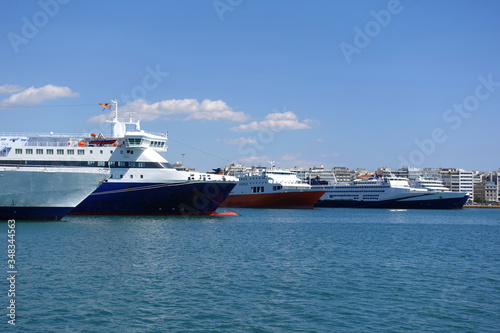 Photo of anchored passenger ferries in busy port of Piraeus on a spring morning  Attica  Greece