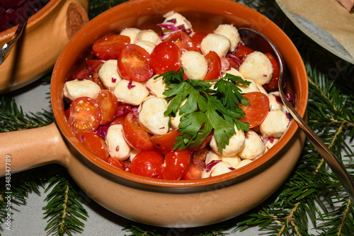 Caprese salad. Mozzarella and cherry tomatoes. Food selection during Sunday brunch buffet in hotel. photo