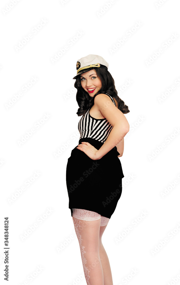 Attractive smiling brunette woman in pin-up style, wearing sailor costume isolated on a white background Attractive smiling brunette woman in pin-up style, wearing sailor costume isolated on a white background
