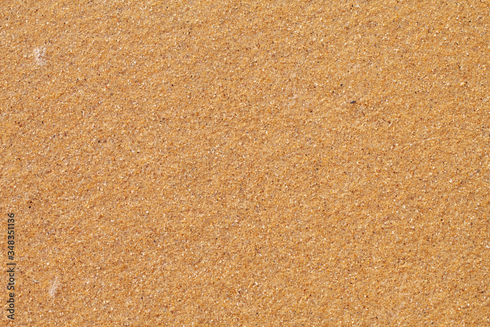 Textured wet sand beach background Textured wet sand beach background