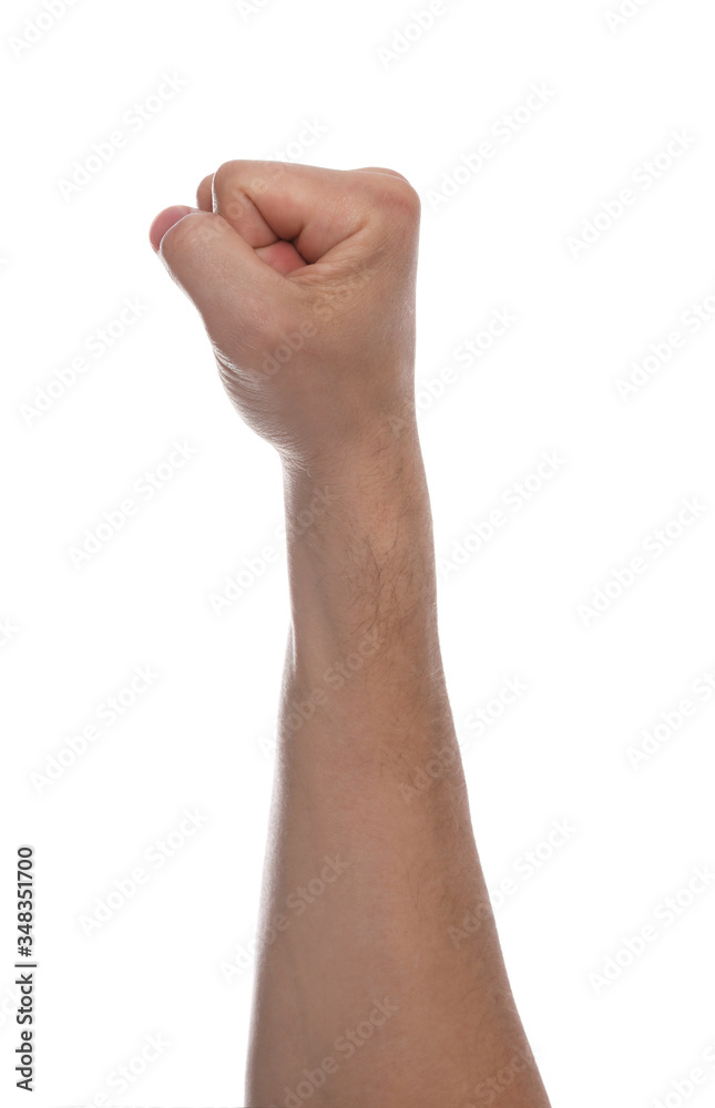 Man with raised fist against white background, closeup of hand Man with raised fist against white background, closeup of hand