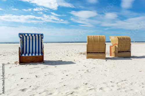 Blue and white striped beach chair or bench © Martin Piechotta