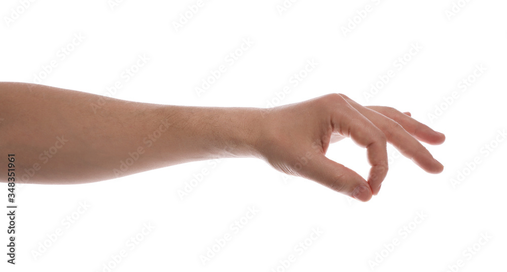 Man holding something against white background, closeup of hand
