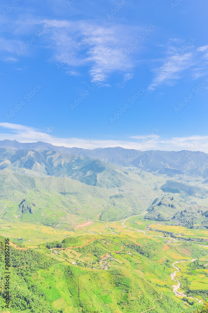 Aerial view of mountain layers surrounds a remote town in Mu Can Chai, Yen Bai, Vietnam