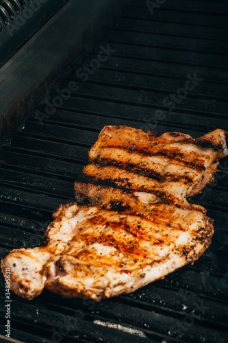 cooking steaks on grill 