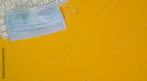 Obraz na płótnie Medical face mask on top of keyboard
