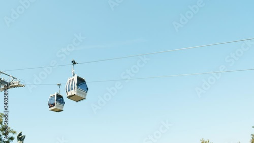 Montjuic cable car in Barcelona on a background of blue sky