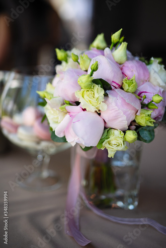 a bouquet of pink flowers stands in a glass vase  flowers in buds  fresh flowers