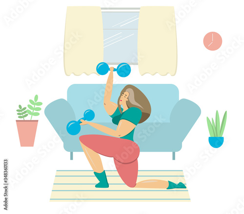 A woman plays sports at home. A girl with dumbbells in her hands is engaged in sports.Sports in quarantine.