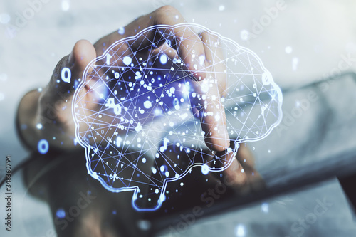 Creative artificial Intelligence concept with human brain sketch and finger presses on a digital tablet on background. Double exposure © Pixels Hunter