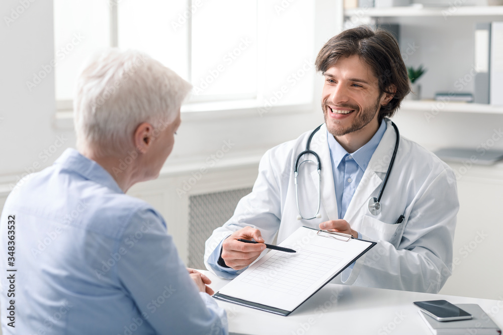 Friendly geriatrician explaining prescription for senior patient Friendly geriatrician explaining prescription for senior patient