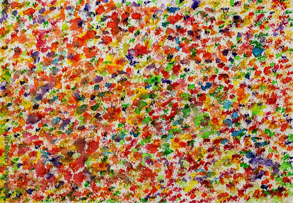 Chaotic bright spots of watercolor paint on a sheet of paper