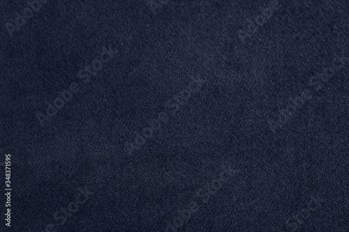 Texture of dark blue fabric as background, closeup