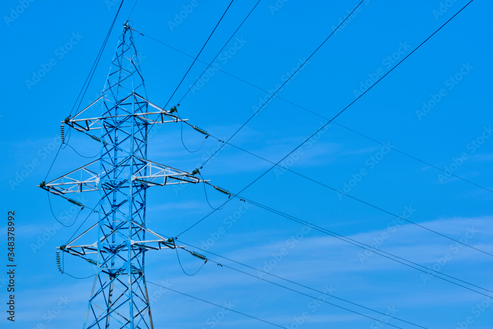 line of power lines against the blue sky color line of power lines against the blue sky color