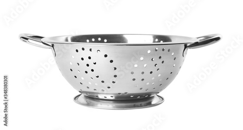 New clean colander isolated on white. Cooking utensils photo
