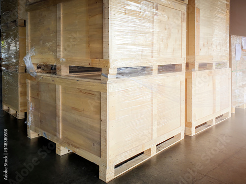 interior of storage warehouse, large shipment crate wooden pallet, cargo import and export, warehouse shipping logistics and transport