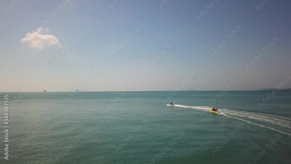 Jetski towing a banana over Andaman sea Jetski towing a banana over Andaman sea
