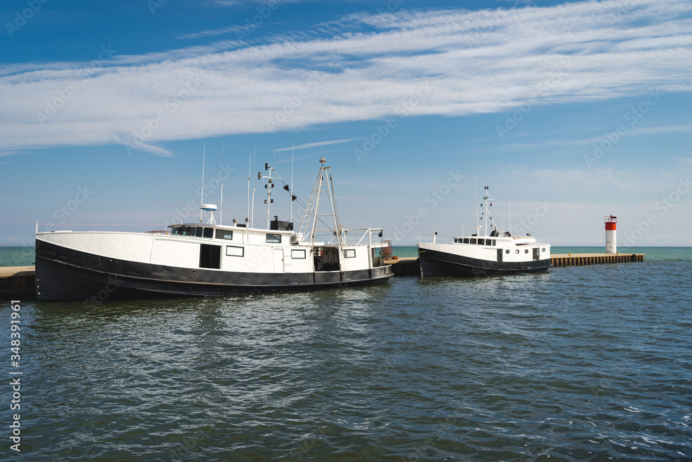 Two commercial fishing boats tied up at port