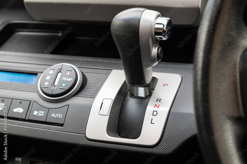 Close up of the manual gearbox transmission handle. Accelerator handle and buttons in a new car. .