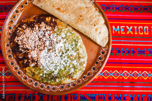 mexican quesadilla with squash blossom, cheese and sauce in mexico city photo