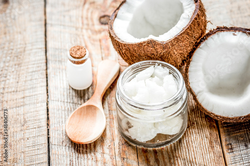 coconut oil for body care in cosmetic concept on old wooden table