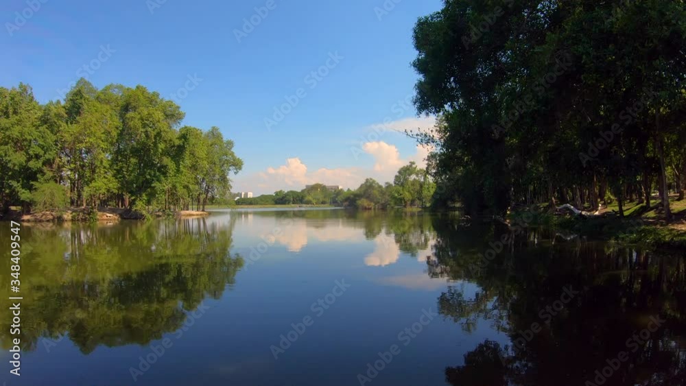 wonderful lake in a forest. shadow of blue sky and clouds moving clear in the lake. daytime lake view. 4k nature background footage.
wonderful lake in a forest. shadow of blue sky and clouds moving clear in the lake. daytime lake view. 4k nature background footage.