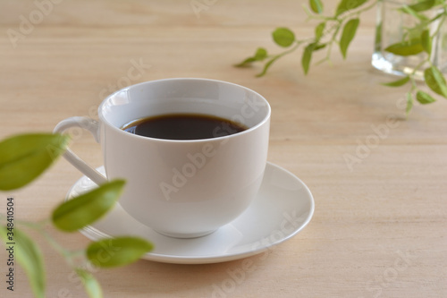 A cup of coffee  on a wooden table