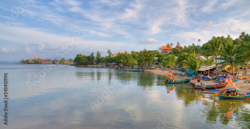Panoramic view of the beach in Koh Samui island with sky reflecting in the water