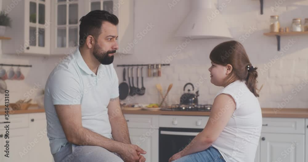 Father talking with daughter