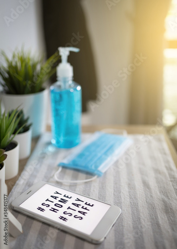 Wallpaper Mural Smartphones, blue sanitary mask and gel bottles washing hands on cabinet. Torontodigital.ca