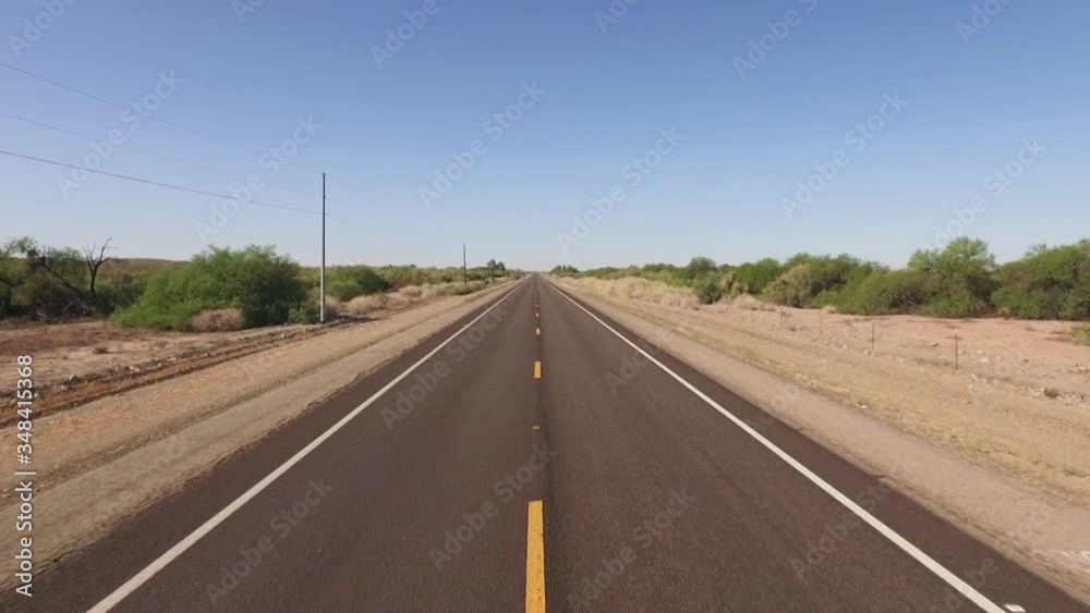 Drone flies over rural highway while flying higher Drone flies over rural highway while flying higher