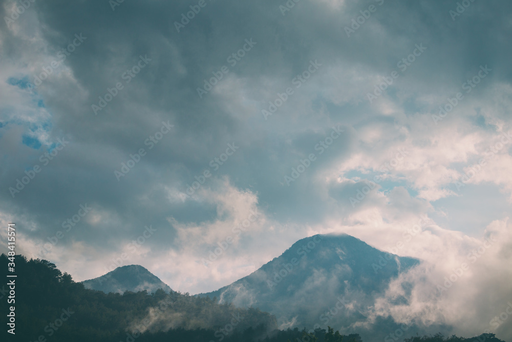 Clouds fell on the mountains during the rain. Clouds fell on the mountains during the rain.