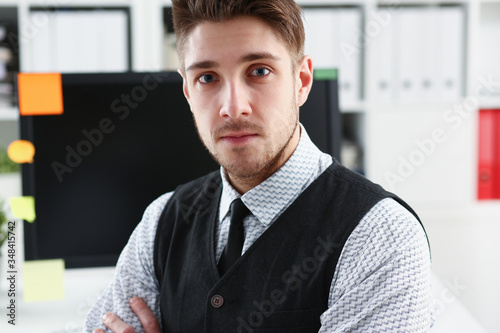 Handsome man in suit and tie stand in office