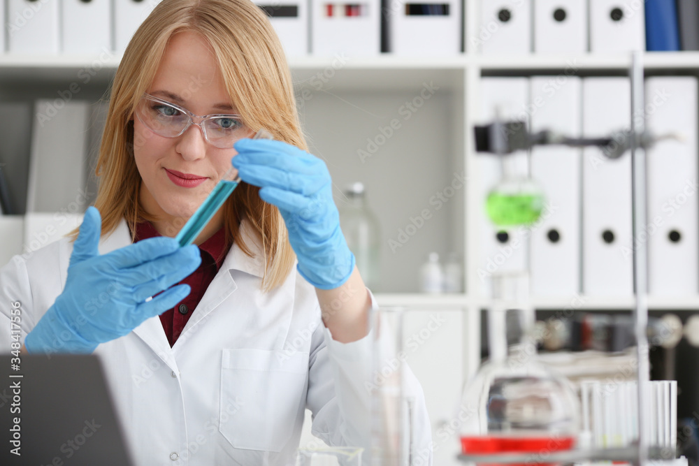Technician hold in arms in protective gloves Technician hold in arms in protective gloves