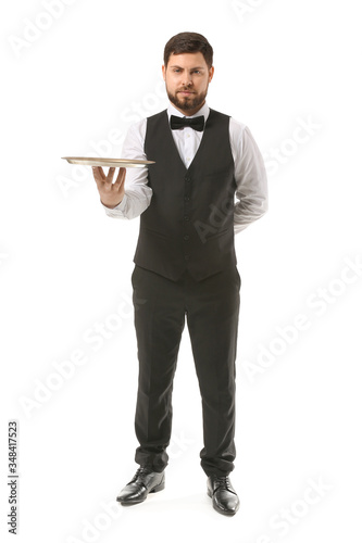 Handsome male waiter on whi...