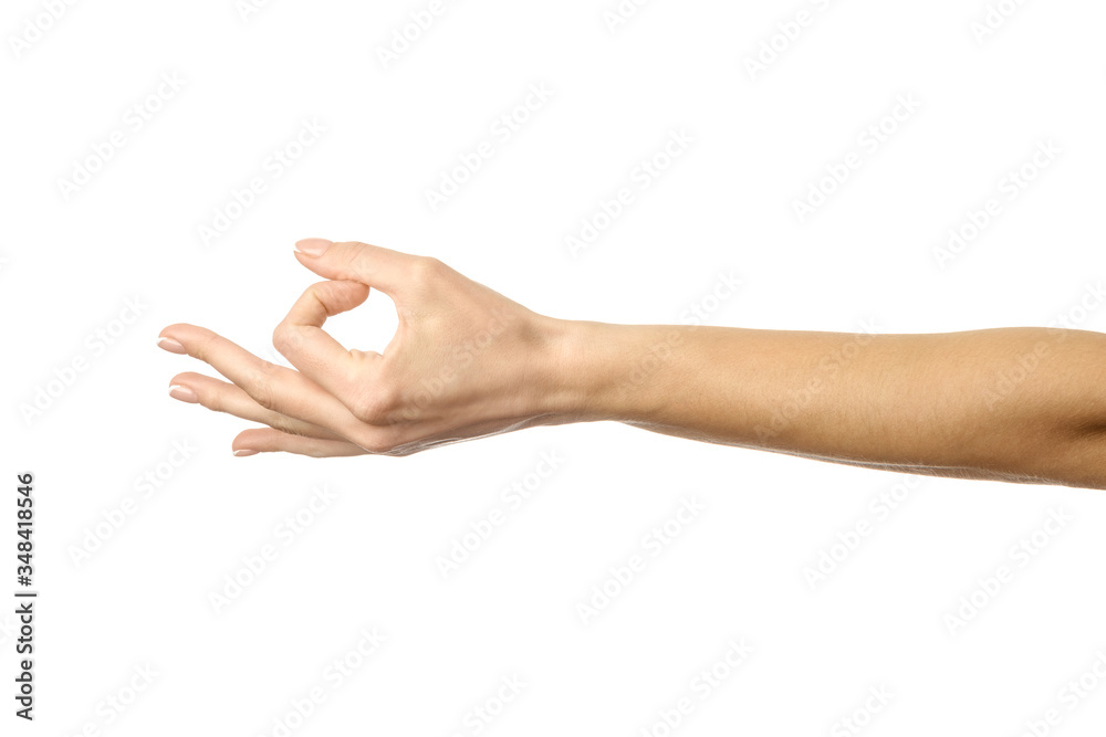Ok sign. Woman hand gesturing isolated on white Ok sign. Woman hand gesturing isolated on white