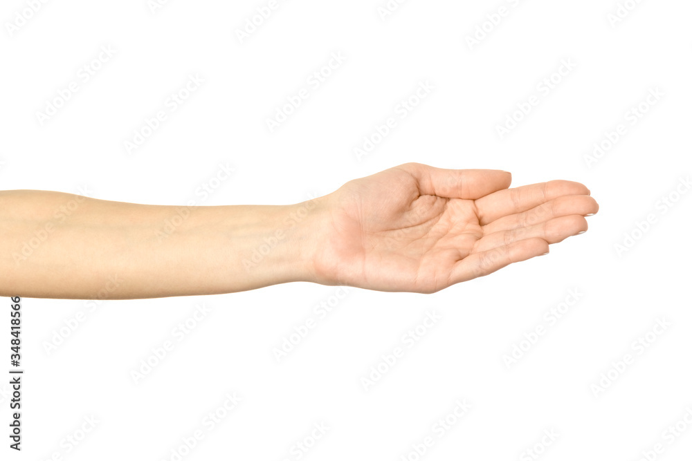 Outstretched female hand. Woman hand gesturing isolated on white Outstretched female hand. Woman hand gesturing isolated on white