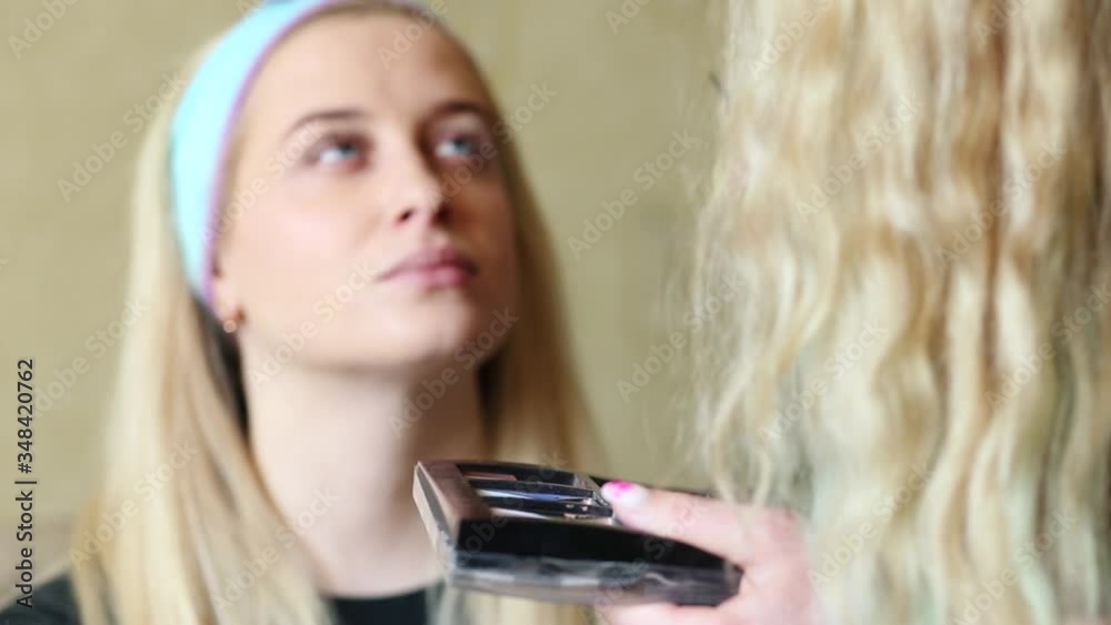 Professional Make Up Artist Doing Make Up at home. Makeup artist colors and emphasizes the eyebrows on the face of the model. Video Professional Make Up Artist Doing Make Up at home. Makeup artist colors and emphasizes the eyebrows on the face of the model. Video