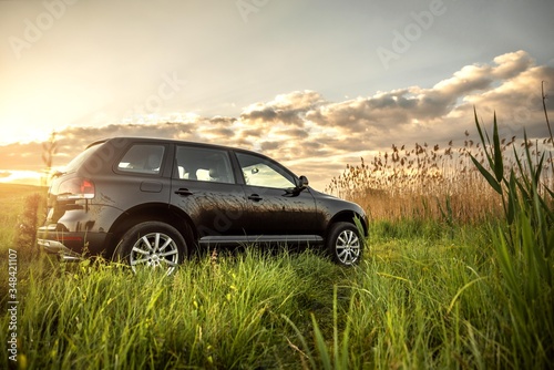 car on the road.
off road vehicle isolated. black suv car photo