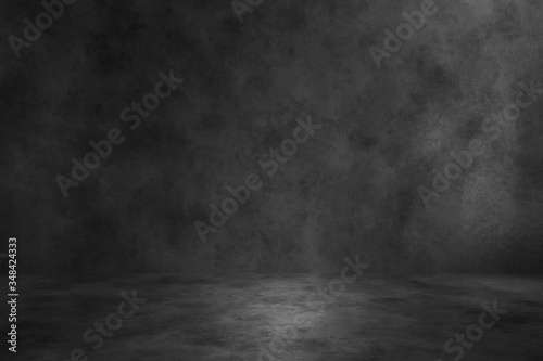 Black concrete background wall. Old surfaces that have scratches and cracks. Black room.