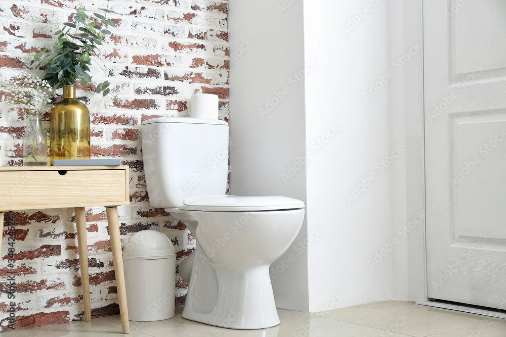 Interior of modern bathroom with floral decor Interior of modern bathroom with floral decor