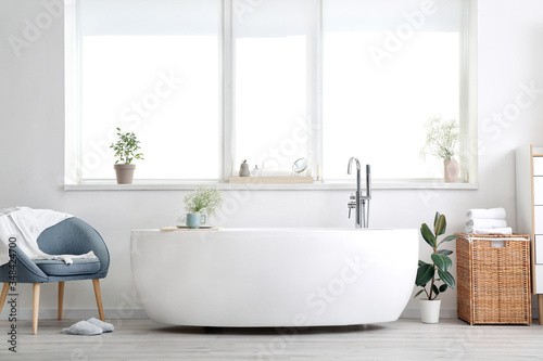 Interior of modern bathroom with floral decor