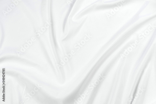 Abstract white fabric texture background. Cloth soft wave. Creases of satin, silk, and cotton. 