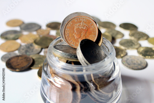 Indian Old vintage coins. Indian old and new coins isolated on white background.  Valid and invalid Indian currencies. Old Indian Currency old Coin - GEORGE VI KING EMPEROR picture highlighted. photo