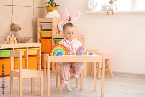 Little girl playing at home