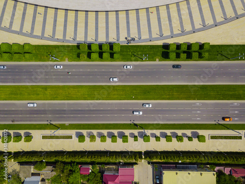 Top down aerial city view of freeway busy city road traffic jam highway.