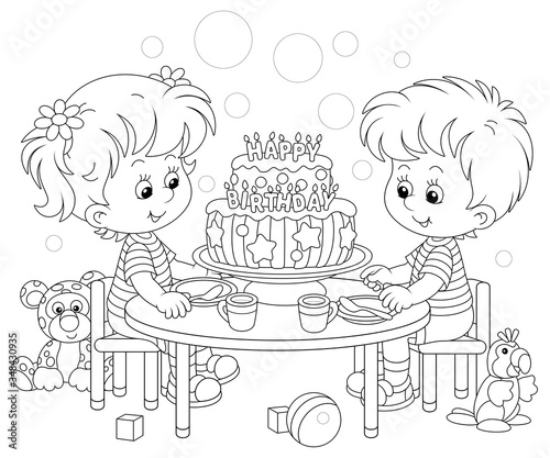 Happy little kids friendly smiling and sitting round their festive board with a fancy birthday cake decorated with letters candles, black and white vector cartoon illustration for a coloring book page