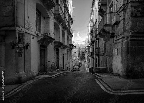 Narrow streets and old walls of the city of Valletta fortress. The capital of the island state is Malta. Black and white