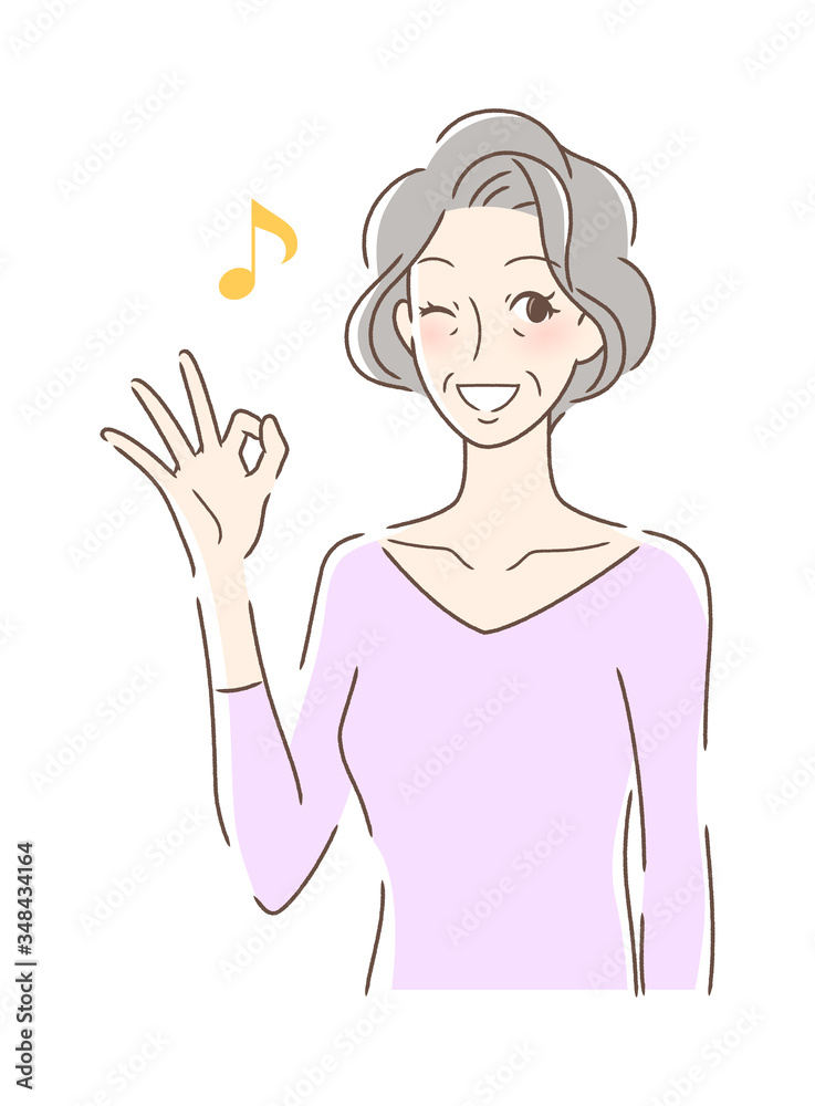 笑顔でOKサインを出す女性 笑顔でOKサインを出す女性