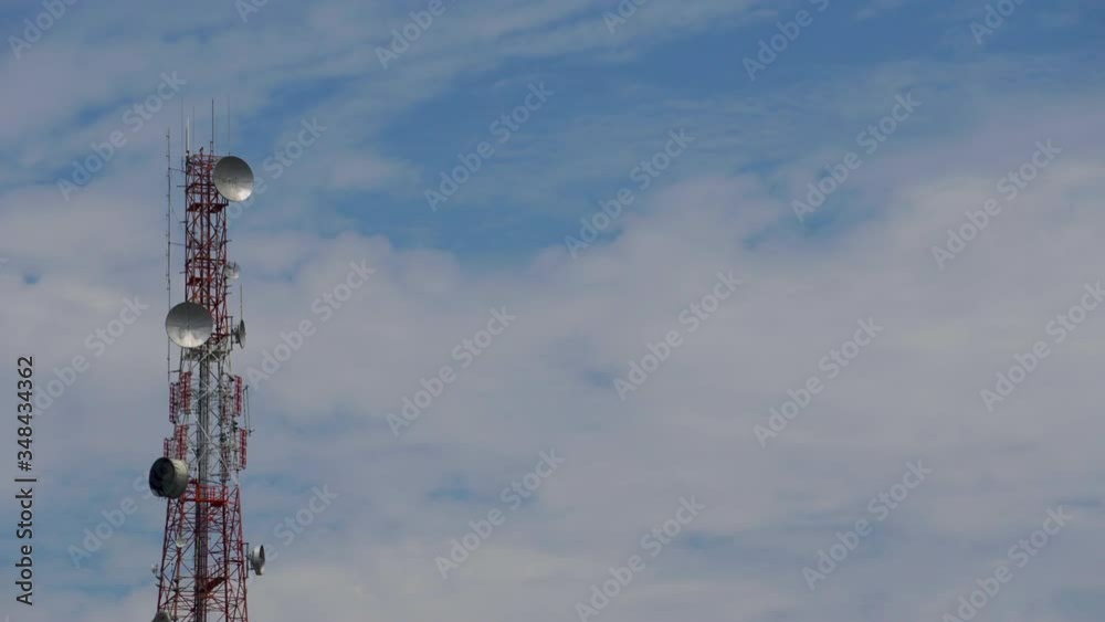 timelaps, large communication towers From behind as clouds and sky timelaps, large communication towers From behind as clouds and sky